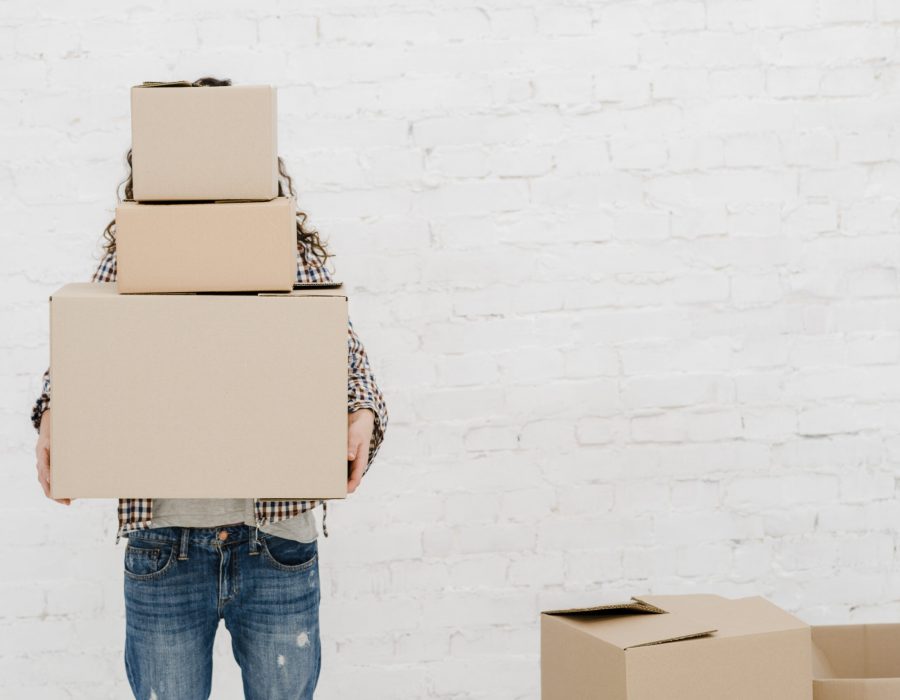 faceless-woman-carrying-boxes